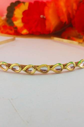Stone stud gold plated  hair band color golden material brass  size free size