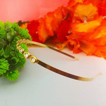 Stone stud gold plated  hair band color golden material brass  size free size 2