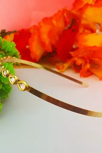 Stone stud gold plated  hair band color golden material brass  size free size