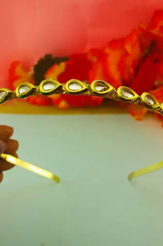 Stone stud gold plated  hair band color golden material brass  size free size
