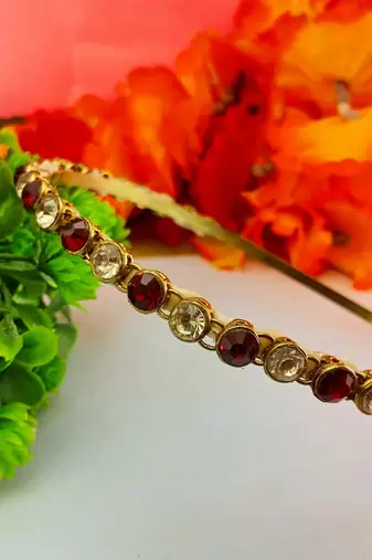 Stone stud gold plated  hair band color golden material brass  size free size