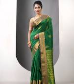 Green ethnic motifs katan silk saree with zari borders