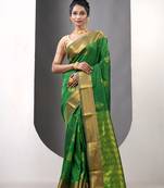 Light green ethnic motifs katan silk saree with zari borders