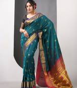 Teal ethnic motifs paithani silk saree with zari borders