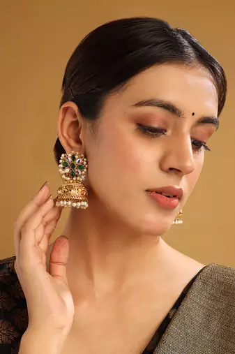 Gold-plated green kundan jhumkas with pearls work – perfect for any occasion