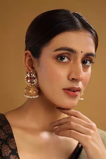 Gold-plated red kundan jhumkas with pearls work – perfect for any occasion