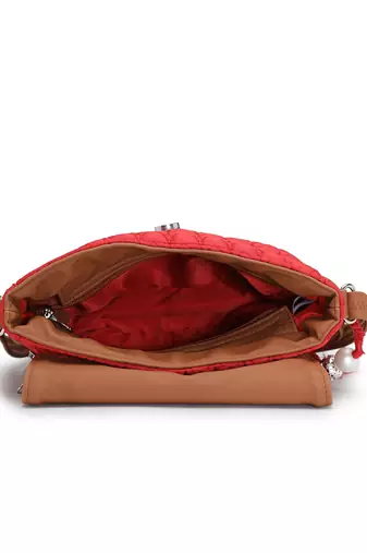 red polyester  sling bag with tassel charm design
