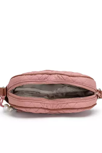 dusty pink polyester sling bag with chevron quilting