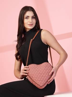 dusty pink polyester sling bag with chevron quilting 10