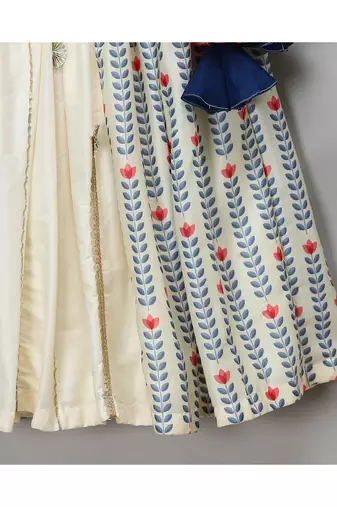 Off white printed off shoulder ruffled blouse lehnga set