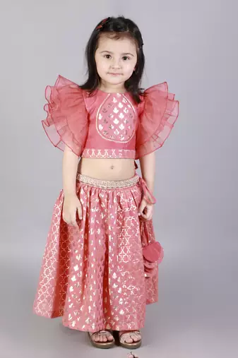 Coral pink ruffled blouse with cotton zari lehnga