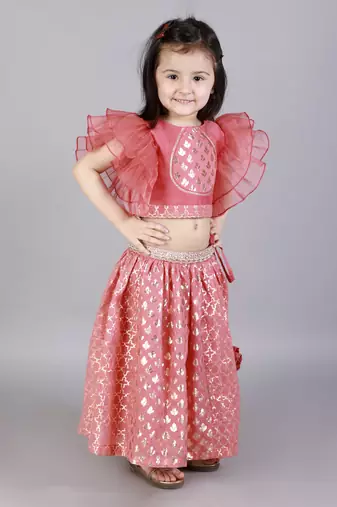 Coral pink ruffled blouse with cotton zari lehnga