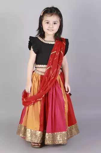 Black ruffled blouse with multi color lehnga