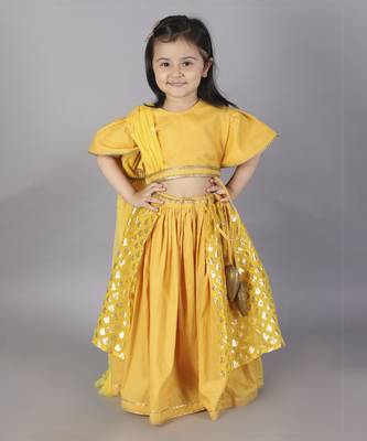 Mustard blouse with attached net dupatta and double layered lehnga 1