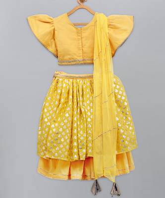 Mustard blouse with attached net dupatta and double layered lehnga 2