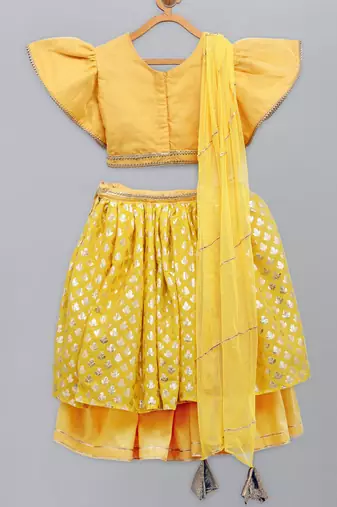 Mustard blouse with attached net dupatta and double layered lehnga