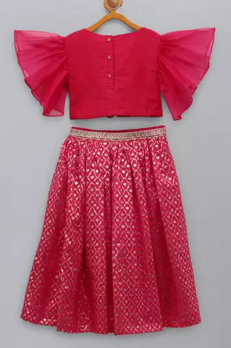 Fuschia pink ruffled blouse with cotton zari lehnga