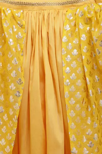 Mustard blouse with attached net dupatta and double layered lehnga