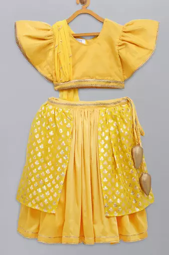 Mustard blouse with attached net dupatta and double layered lehnga