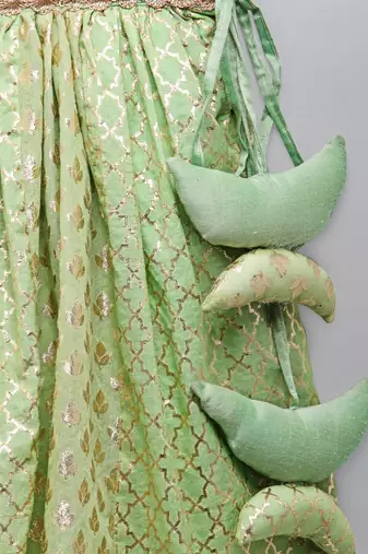 Lime green organza ruffled blouse with cotton zari lehnga