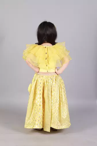 Lime yellow organza ruffled blouse with cotton zari lehnga