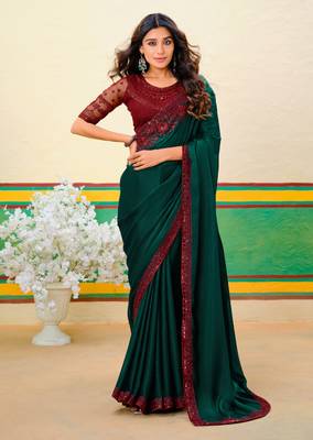 Dark green embroidered heavy partywear saree 1