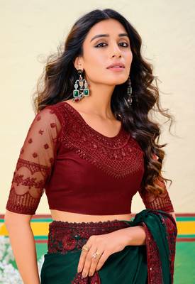 Dark green embroidered heavy partywear saree 2