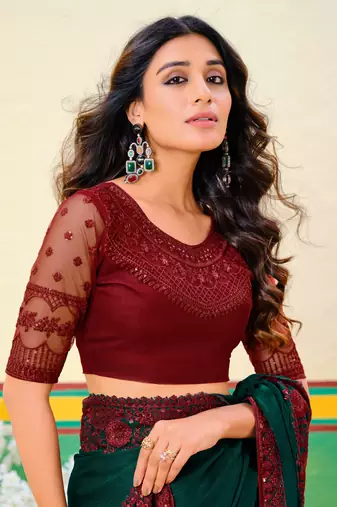 Dark green embroidered heavy partywear saree