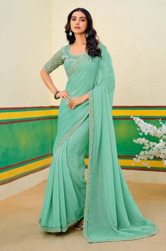 Teal green embroidered heavy partywear saree