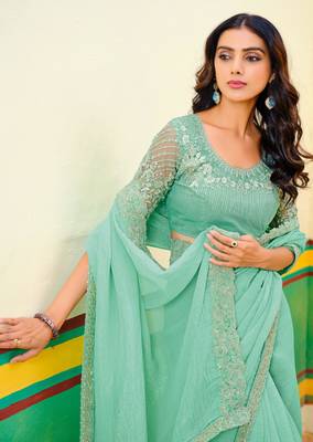 Teal green embroidered heavy partywear saree 2