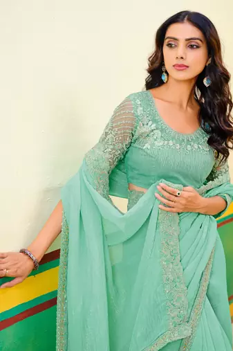 Teal green embroidered heavy partywear saree