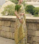Green jacquard silk woven saree with embroidered blouse