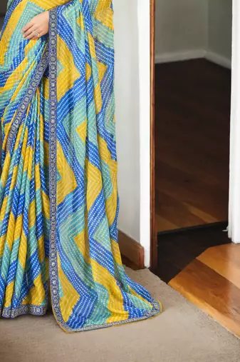 Blue chinon c printed saree with embroidered blouse