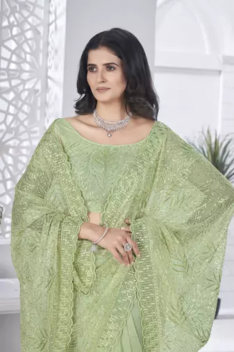 Green girlie tissue net c embroidered saree