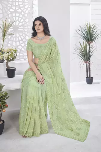 Green girlie tissue net c embroidered saree