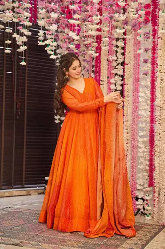 Glamorous bollywood style orange chinon partywear gown