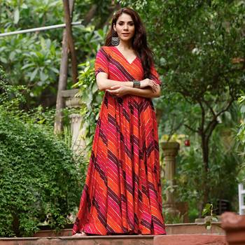 Glamorous bollywood style orange rayon partywear gown 1