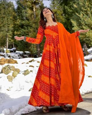 Glamorous bollywood style orange rayon partywear gown 1