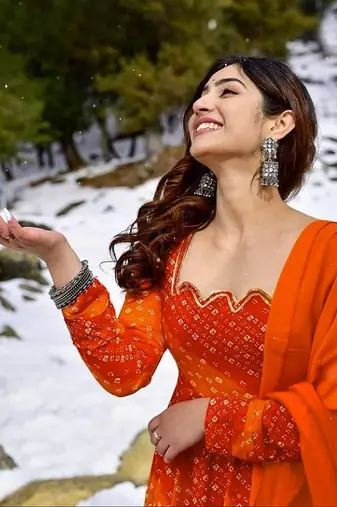 Glamorous bollywood style orange rayon partywear gown