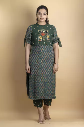 Pine green kurta set embellished with beautiful zardozi and intricate details on pure ajrakh fabric