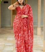 Coral red chiffon floral print saree with unstitched blouse piece