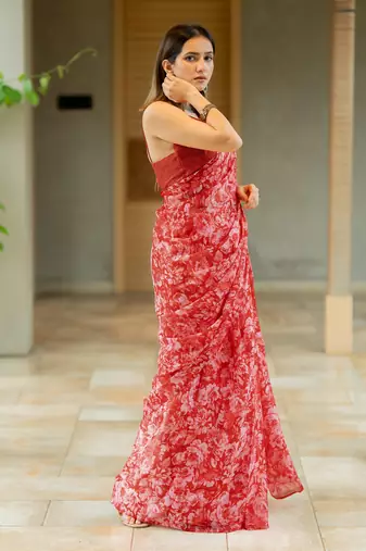 Coral red chiffon floral print saree with unstitched blouse piece