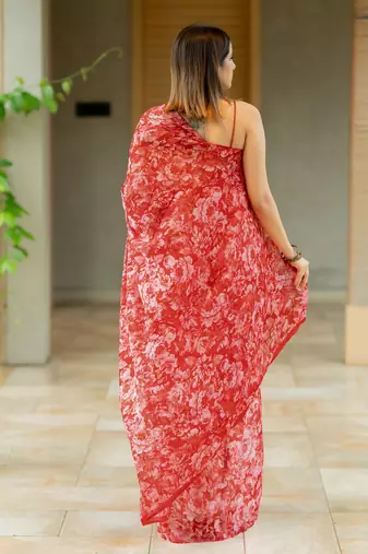 Coral red chiffon floral print saree with unstitched blouse piece