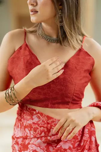 Coral red chiffon floral print saree with unstitched blouse piece