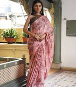 Peach pink chiffon floral print saree with unstitched blouse piece