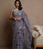 Lavender kota doria polyester floral print golden zari border saree