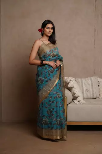 Turquoise kota doria polyester floral print golden zari border saree