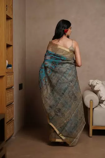 Turquoise kota doria polyester floral print golden zari border saree