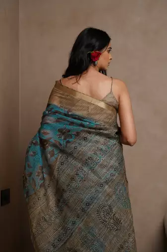Turquoise kota doria polyester floral print golden zari border saree