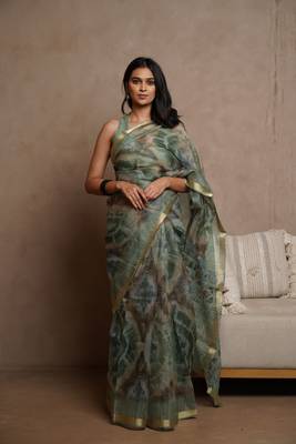 Dusty green kota doria polyester shibori print golden zari border saree 1
